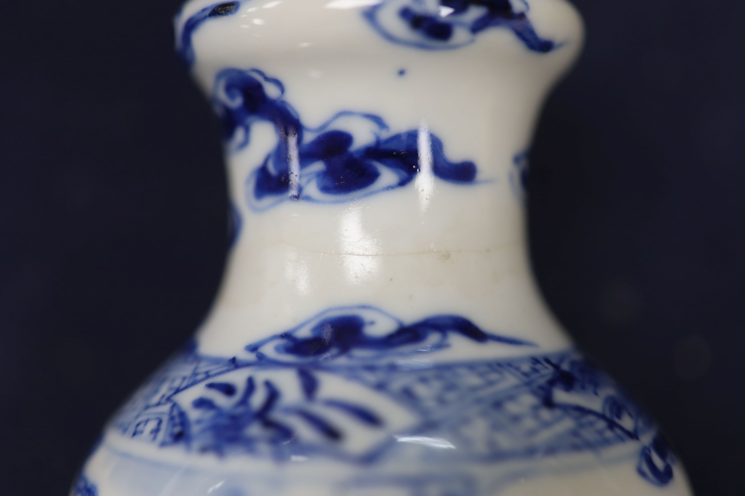 Two Chinese blue and white vases and a dish, together with a famille rose dish, tallest 28cm